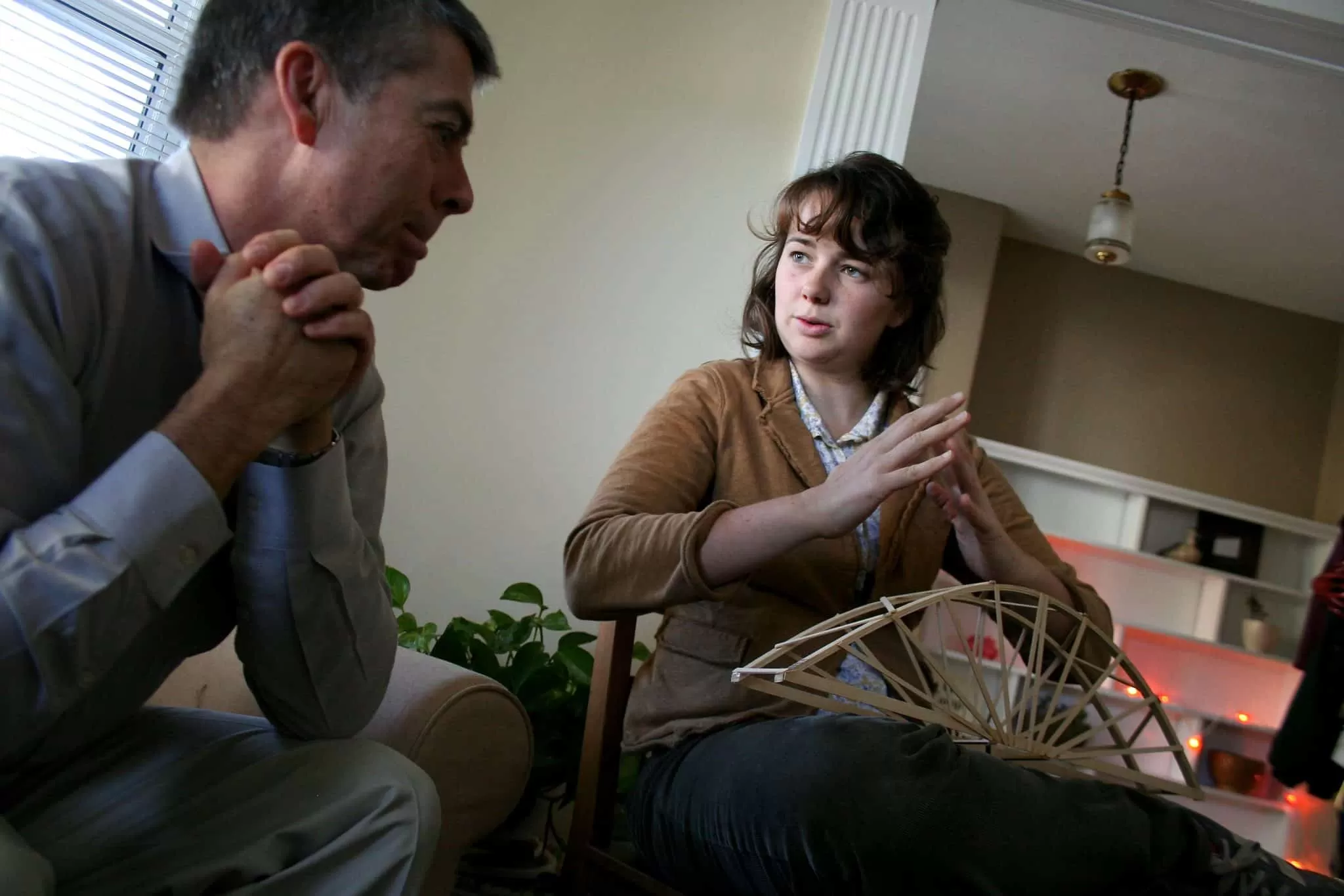A daughter explains load tensioning and other details about building a bridge with her father.