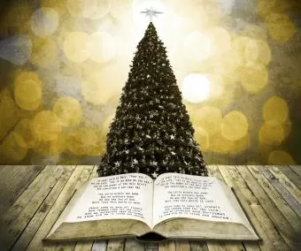 Light shining through trees, symbolizing the inspiration of Christmas