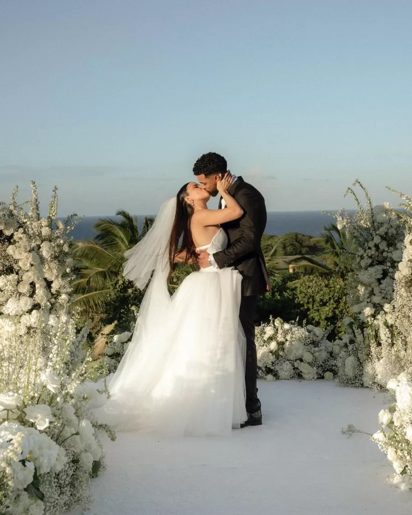 Image of a couple holding hands with rings visible